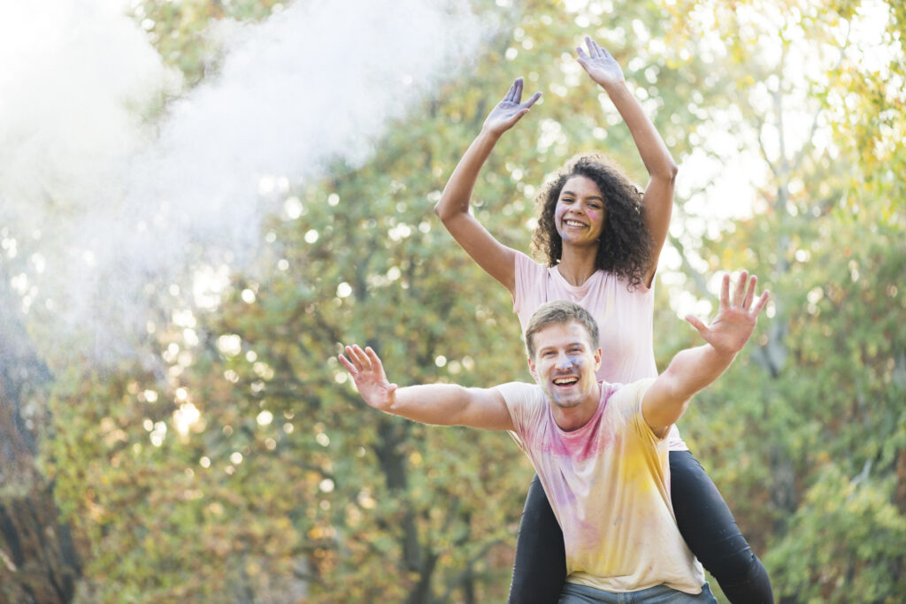 couple happily posing festival