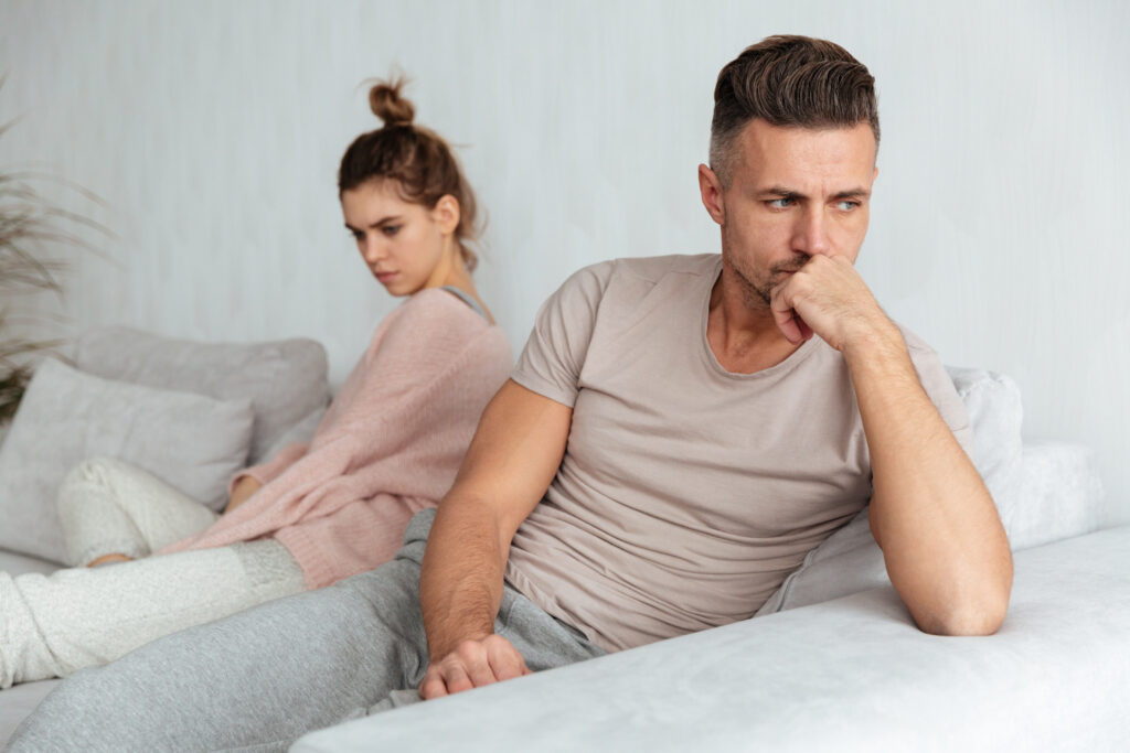 image quarrelled lovely couple sitting separately couch home