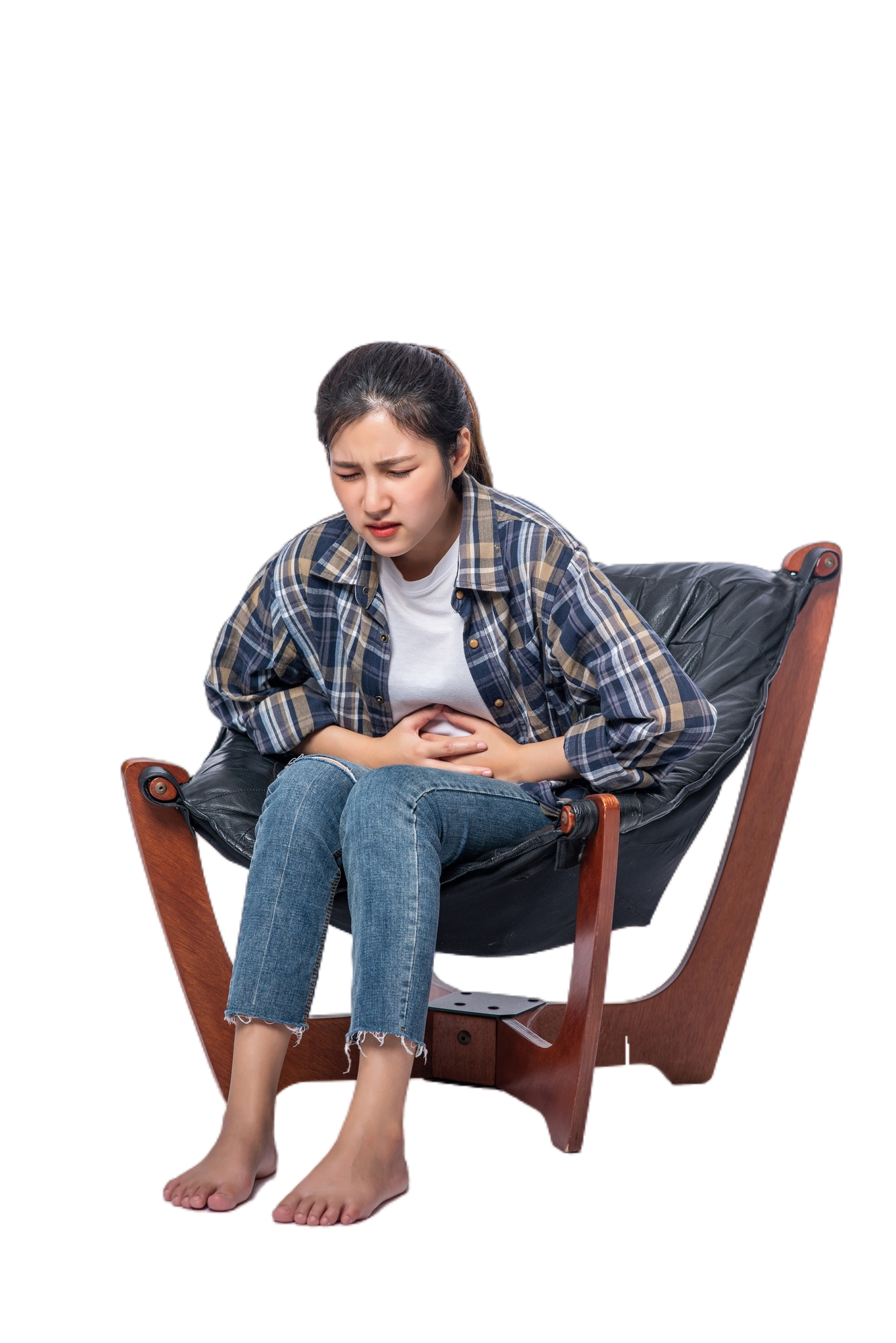 woman sitting chair with abdominal pain pressing her hand her stomach