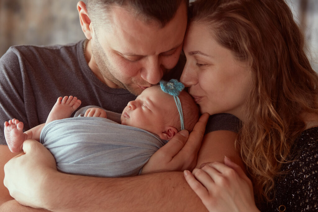 The Future of Fertility: Latest Innovations in IVF and Reproductive Technologies 10 mother father embracing their daughter